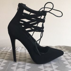 Black lace up stiletto. Worn once. Size 7. No box.